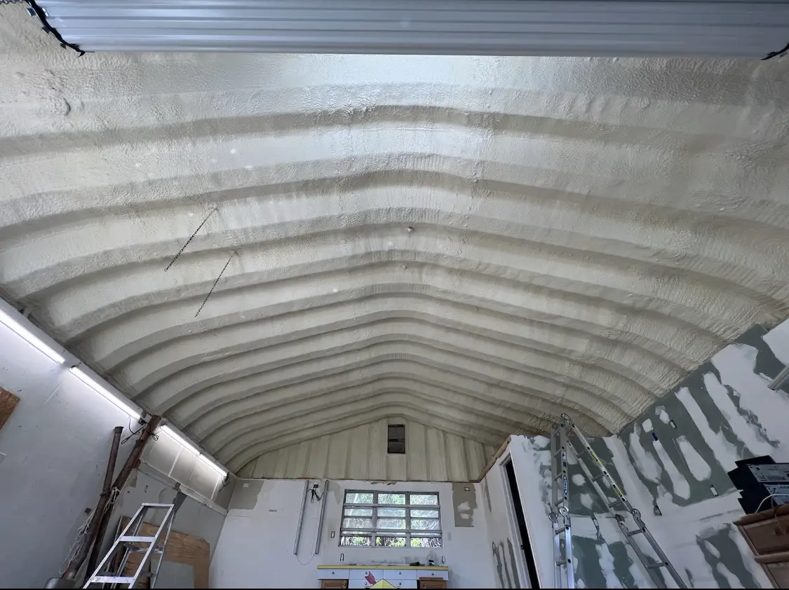 Spray polyurethane foam applied to the underside of a metal roof deck in Dunkirk